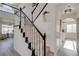 Carpeted staircase with white railings and black trim, leading to the upper level at 1100 Meridian Bay Dr, Las Vegas, NV 89128