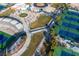 Aerial view of community tennis courts and stadium seating, perfect for sports enthusiasts at 1100 Meridian Bay Dr, Las Vegas, NV 89128