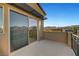 Balcony featuring a sliding glass door that allows natural light with city and mountain views at 11297 Essence Point Ave # 102, Las Vegas, NV 89135