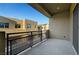 Private balcony showcases views of surrounding buildings with a modern metal railing at 11297 Essence Point Ave # 102, Las Vegas, NV 89135