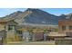 Picturesque rooftop view featuring desert landscaping and city lights with mountain backdrop in the distance at 11297 Essence Point Ave # 102, Las Vegas, NV 89135