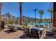 Outdoor community space featuring comfortable seating, gas fire pits, palm trees and neighborhood views at 11297 Essence Point Ave # 102, Las Vegas, NV 89135