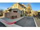 Exterior view of the townhome with its modern architecture and private parking at 11297 Essence Point Ave # 102, Las Vegas, NV 89135