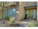 Inviting home exterior featuring a green front door and desert landscaping at 11297 Essence Point Ave # 102, Las Vegas, NV 89135