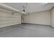 Well-maintained garage features sealed concrete flooring, ample space for parking, and convenient door access at 11297 Essence Point Ave # 102, Las Vegas, NV 89135
