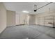 Spacious garage featuring epoxy flooring, storage cabinets, and ample room for vehicles and storage solutions at 11297 Essence Point Ave # 102, Las Vegas, NV 89135
