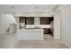 Bright and airy kitchen with a central island, stainless appliances, and modern finishes at 11297 Essence Point Ave # 102, Las Vegas, NV 89135