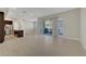 Expansive living room with tile flooring and access to an outdoor balcony at 11297 Essence Point Ave # 102, Las Vegas, NV 89135