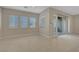 The living room features tile floors, recessed lighting, and sliding glass doors to the patio at 11297 Essence Point Ave # 102, Las Vegas, NV 89135