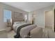 Staged main bedroom features plush carpet, natural light, and a large walk-in closet at 11297 Essence Point Ave # 102, Las Vegas, NV 89135