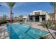 Community pool area offering residents shaded seating and palm trees perfect for relaxing in the sun at 11297 Essence Point Ave # 102, Las Vegas, NV 89135