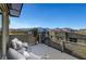 This rooftop deck features lounge seating, a potted tree, and scenic mountain views at 11297 Essence Point Ave # 102, Las Vegas, NV 89135