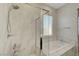 This bathroom features a shower and soaking tub with marble countertops at 11297 Essence Point Ave # 102, Las Vegas, NV 89135
