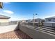 Balcony with wood tiles overlooks rooftops and neighborhood at 11756 Emerald Lake Ave, Las Vegas, NV 89138