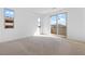 Spacious bedroom bathed in natural light, featuring a sliding glass door to a balcony at 11756 Emerald Lake Ave, Las Vegas, NV 89138