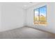 Bedroom featuring carpet and a window with mountain views at 11756 Emerald Lake Ave, Las Vegas, NV 89138
