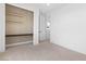Bright bedroom featuring a built-in desk with shelves and neutral carpeting at 11756 Emerald Lake Ave, Las Vegas, NV 89138