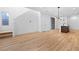 Bright, open-concept living area with wood flooring, recessed lighting, and access to the backyard at 11756 Emerald Lake Ave, Las Vegas, NV 89138