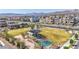 Aerial view of a park in a community, featuring a playground and green space at 11756 Emerald Lake Ave, Las Vegas, NV 89138