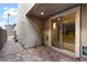 Outdoor patio featuring brick pavers and sliding glass doors into the home's interior at 11756 Emerald Lake Ave, Las Vegas, NV 89138