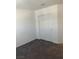 Bedroom featuring neutral walls, carpet flooring and closet with sliding doors at 1197 Mission View Ct, Henderson, NV 89002