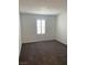 Carpeted bedroom featuring a shuttered window, blank walls and ceiling fan at 1197 Mission View Ct, Henderson, NV 89002