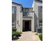 Inviting front exterior showcasing the entryway with a small balcony and brick pathway at 1197 Mission View Ct, Henderson, NV 89002