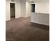 Open loft area with neutral walls, carpet, and access to multiple rooms at 1197 Mission View Ct, Henderson, NV 89002