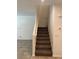 Interior view showcasing a carpeted staircase with white walls and access to the living area at 1197 Mission View Ct, Henderson, NV 89002