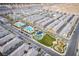 Aerial view of a community with a pool, playground, and green spaces at 12108 Harvest Sky Way # 1, Las Vegas, NV 89183