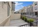 Cozy back patio with a privacy fence and iron railing at 12108 Harvest Sky Way # 1, Las Vegas, NV 89183