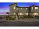 Two-story townhome with desert landscaping, a small front yard, and a private entrance at 12108 Harvest Sky Way # 1, Las Vegas, NV 89183