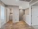 Upstairs hallway with wood-look floors leading to bedrooms at 12108 Harvest Sky Way # 1, Las Vegas, NV 89183