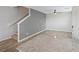 Open-concept living area with staircase and modern ceiling fan at 12108 Harvest Sky Way # 1, Las Vegas, NV 89183