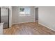 Bright living space featuring wood-look flooring and a large window at 12108 Harvest Sky Way # 1, Las Vegas, NV 89183