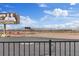 Real estate view from the property showing the desert landscape and billboard advertising realtors at 12108 Harvest Sky Way # 1, Las Vegas, NV 89183