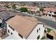 An aerial view of the rear of the house with a tile roof and a small yard at 1283 Peppercorn Ave, Henderson, NV 89012