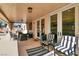 Covered patio with ample seating and double doors leading inside at 1283 Peppercorn Ave, Henderson, NV 89012