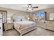 Bedroom featuring a large window with wooden shutters and carpet floors at 1283 Peppercorn Ave, Henderson, NV 89012
