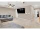 Upstairs bonus room with plush carpeting and a large TV at 1283 Peppercorn Ave, Henderson, NV 89012