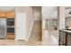 Inviting entryway featuring stairs, tile flooring, stainless steel appliances and a modern interior design at 1283 Peppercorn Ave, Henderson, NV 89012