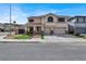 Charming two-story home featuring a well-manicured front yard and a three-car garage, perfect for a growing Gathering at 1283 Peppercorn Ave, Henderson, NV 89012