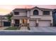 Charming two-story home with a well-manicured lawn, a two-car garage, and a welcoming front porch, perfect for families at 1283 Peppercorn Ave, Henderson, NV 89012