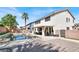 Spacious backyard oasis with a sparkling pool, spa, and covered patio at 1283 Peppercorn Ave, Henderson, NV 89012