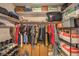 Organized walk-in closet with clothing racks, shelves, and storage boxes at 1375 E Hacienda Ave # 114, Las Vegas, NV 89119