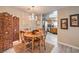 Charming dining area with a chandelier, leading to a kitchen at 1375 E Hacienda Ave # 114, Las Vegas, NV 89119