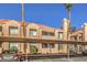Apartment exterior with covered parking and desert landscaping against a blue sky at 1375 E Hacienda Ave # 114, Las Vegas, NV 89119