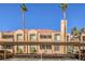 Multi-Gathering building with red tile roof, palm trees, and covered parking at 1375 E Hacienda Ave # 114, Las Vegas, NV 89119