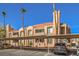 Exterior of building with covered parking, desert landscaping, and tile roof at 1375 E Hacienda Ave # 114, Las Vegas, NV 89119
