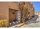 Close up of front entrance with white security door and desert landscaping at 1375 E Hacienda Ave # 114, Las Vegas, NV 89119